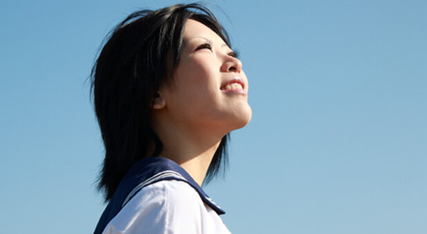 Asian woman looking up