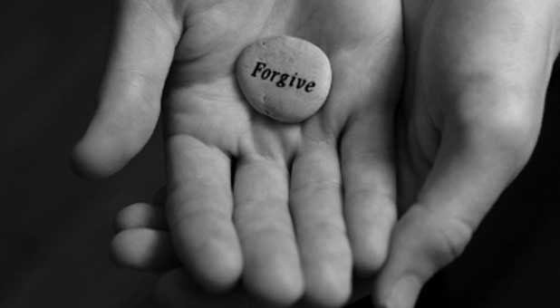 hand-with-word-forgiveness