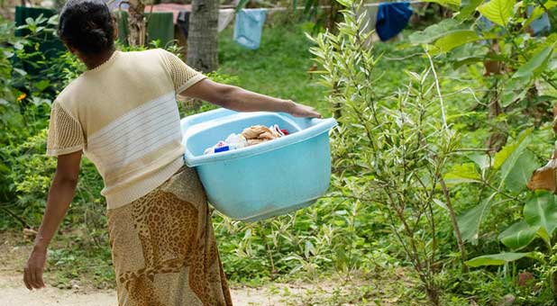 Indian woman carrying laundry
