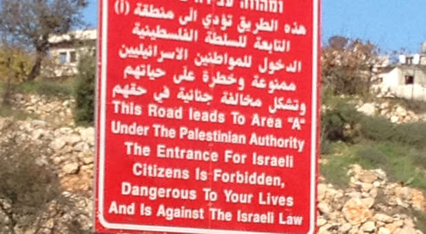 A modern-day posted sign leading into Bethlehem warns Jews to keep away.