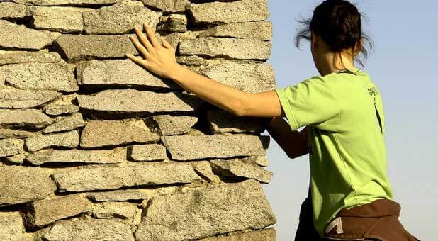 woman hitting a wall