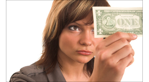 woman holding last dollar